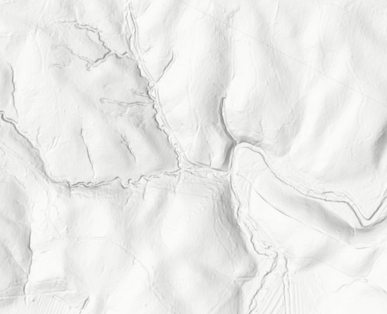 LiDAR hillshade bare-earth view: ridges, valleys, a meandering creek, tributaries, and subtle benches; shadows emphasize terrain relief.